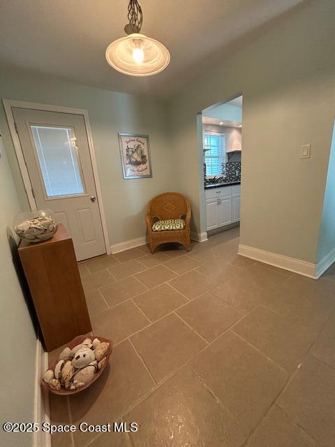 351 Taylor Ave Unit E5, Cape Canaveral, FL 32920 - living area with tile patterned floors and baseboards