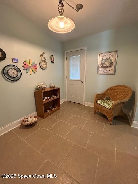 351 Taylor Ave Unit E5, Cape Canaveral, FL 32920 - tiled foyer featuring baseboards