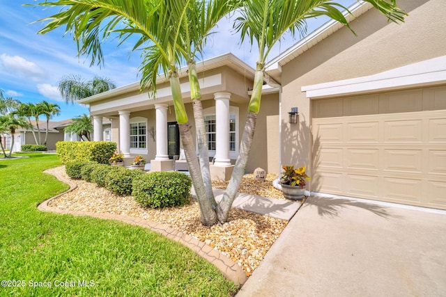 5337 Indigo Crossing Dr, Rockledge, FL 32955 - view of front of property featuring stucco siding, a front yard, an attached garage, and concrete driveway