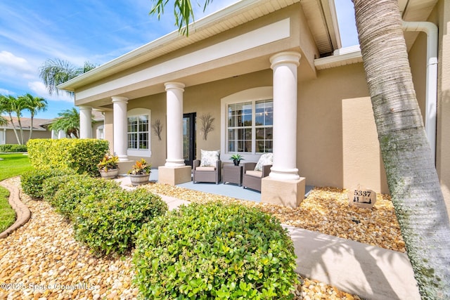 5337 Indigo Crossing Dr, Rockledge, FL 32955 - property entrance with stucco siding and a porch