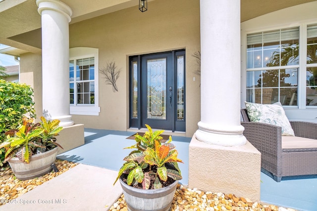 5337 Indigo Crossing Dr, Rockledge, FL 32955 - entrance to property with stucco siding and covered porch