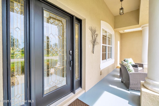 5337 Indigo Crossing Dr, Rockledge, FL 32955 - property entrance with stucco siding and a balcony