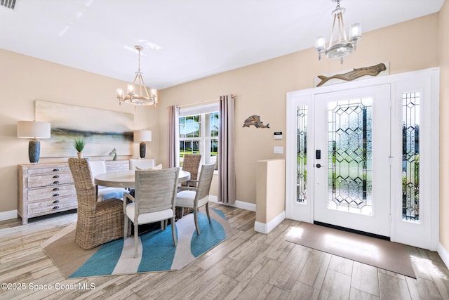 5337 Indigo Crossing Dr, Rockledge, FL 32955 - entryway with a chandelier and wood finished floors