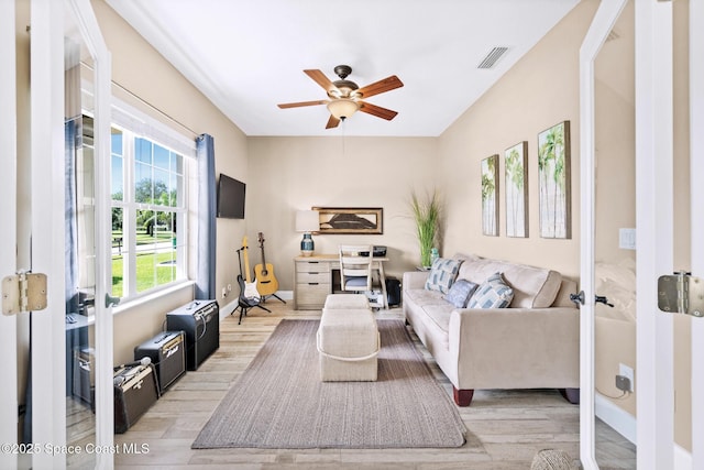5337 Indigo Crossing Dr, Rockledge, FL 32955 - living room featuring light wood-type flooring, a ceiling fan, and french doors