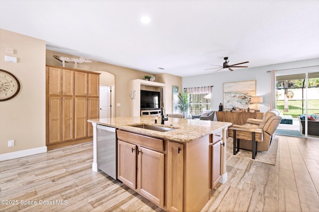 5337 Indigo Crossing Dr, Rockledge, FL 32955 - kitchen with stainless steel dishwasher, light wood finished floors, a ceiling fan, and open floor plan