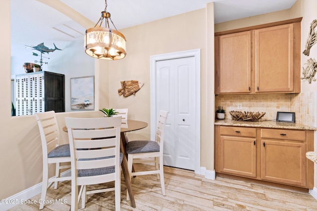 5337 Indigo Crossing Dr, Rockledge, FL 32955 - dining room featuring a chandelier and light wood-type flooring