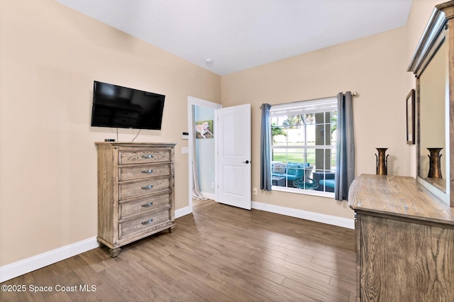 5337 Indigo Crossing Dr, Rockledge, FL 32955 - bedroom with baseboards and dark wood-type flooring