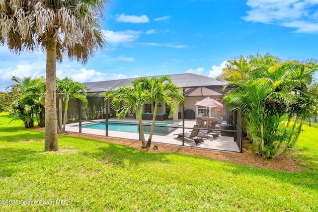 5337 Indigo Crossing Dr, Rockledge, FL 32955 - outdoor pool with a patio, a lawn, and a lanai