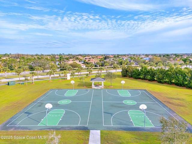 5337 Indigo Crossing Dr, Rockledge, FL 32955 - view of sport court featuring community basketball court, a yard, and a residential view