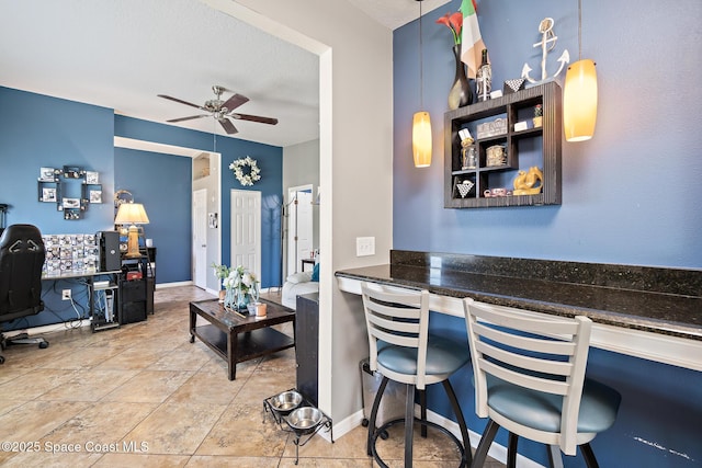 113 Surf Dr, Cocoa Beach, FL 32931 - office with a ceiling fan and baseboards