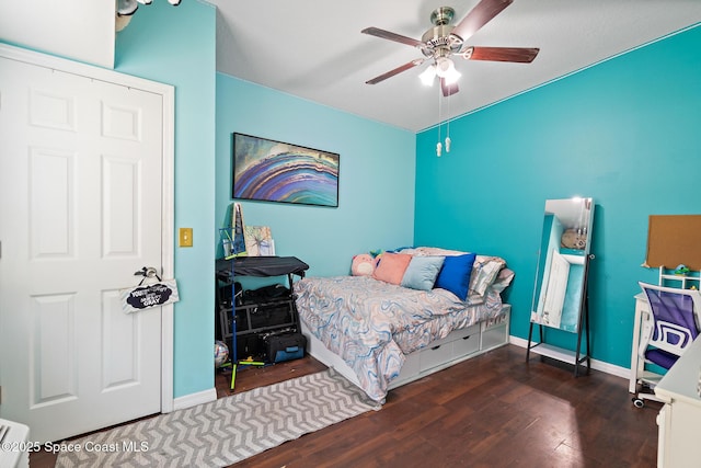 113 Surf Dr, Cocoa Beach, FL 32931 - bedroom featuring wood finished floors and a ceiling fan