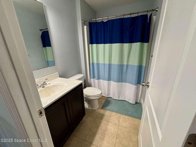 3725 Aria Dr, Melbourne, FL 32904 - full bathroom with vanity, tile patterned floors, and a shower with shower curtain