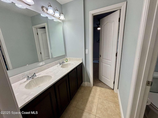 3725 Aria Dr, Melbourne, FL 32904 - bathroom with double vanity and tile patterned flooring