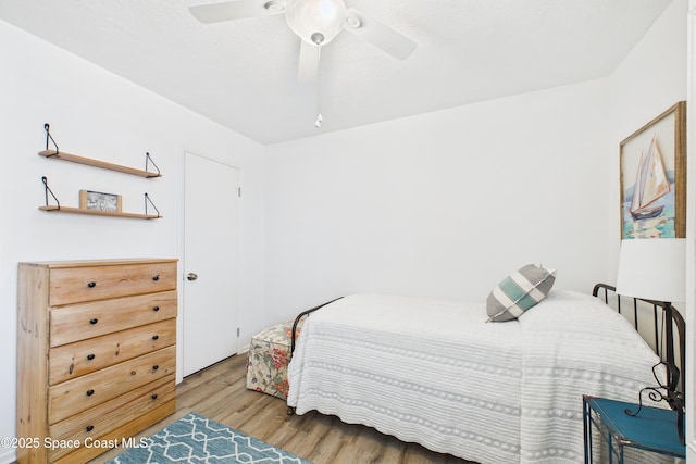 3190 N Atlantic Ave Unit 220, Cocoa Beach, FL 32931 - bedroom with wood finished floors and a ceiling fan