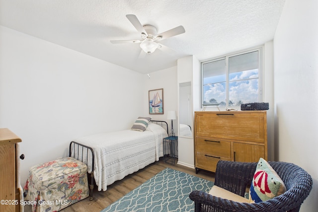 3190 N Atlantic Ave Unit 220, Cocoa Beach, FL 32931 - bedroom featuring wood finished floors and a ceiling fan