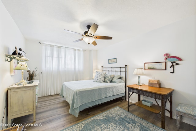3190 N Atlantic Ave Unit 220, Cocoa Beach, FL 32931 - bedroom with wood finished floors and a ceiling fan