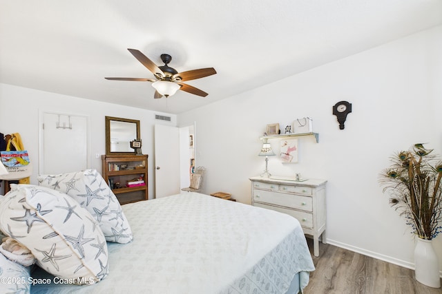 3190 N Atlantic Ave Unit 220, Cocoa Beach, FL 32931 - bedroom with wood finished floors and ceiling fan