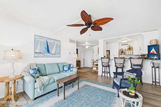 3190 N Atlantic Ave Unit 220, Cocoa Beach, FL 32931 - living area featuring a ceiling fan and wood finished floors