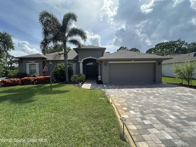 1796 Windbrook Dr SE, Palm Bay, FL 32909 - ranch-style house with stucco siding, decorative driveway, an attached garage, and a front yard