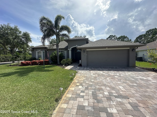 1796 Windbrook Dr SE, Palm Bay, FL 32909 - view of front of property featuring driveway, stucco siding, a garage, and a front yard