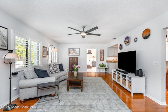 1453 Goldrush Ave, Melbourne, FL 32940 - living area featuring a ceiling fan and wood finished floors