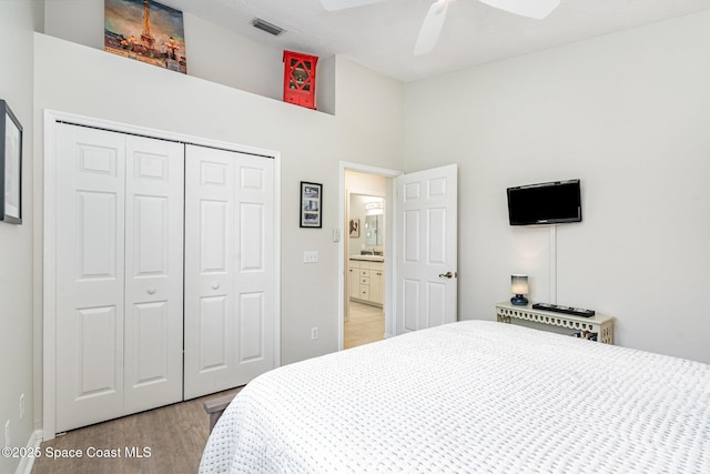 1453 Goldrush Ave, Melbourne, FL 32940 - bedroom featuring wood finished floors, a closet, ceiling fan, and a towering ceiling