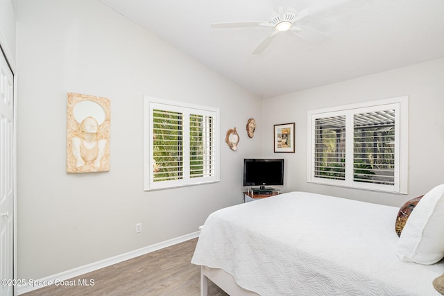 1453 Goldrush Ave, Melbourne, FL 32940 - bedroom with light wood-type flooring, lofted ceiling, and a ceiling fan