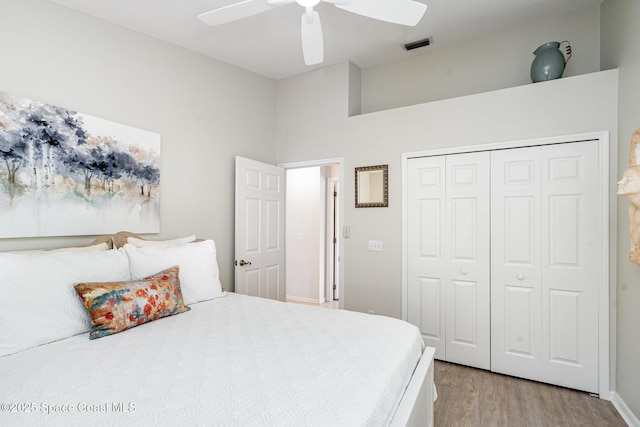 1453 Goldrush Ave, Melbourne, FL 32940 - bedroom with light wood-style floors, a closet, and a ceiling fan