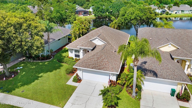 4490 Portage Trl, Melbourne, FL 32940 - aerial perspective of suburban area with a large body of water