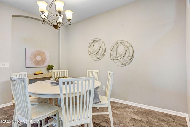 4490 Portage Trl, Melbourne, FL 32940 - dining room with a chandelier and baseboards