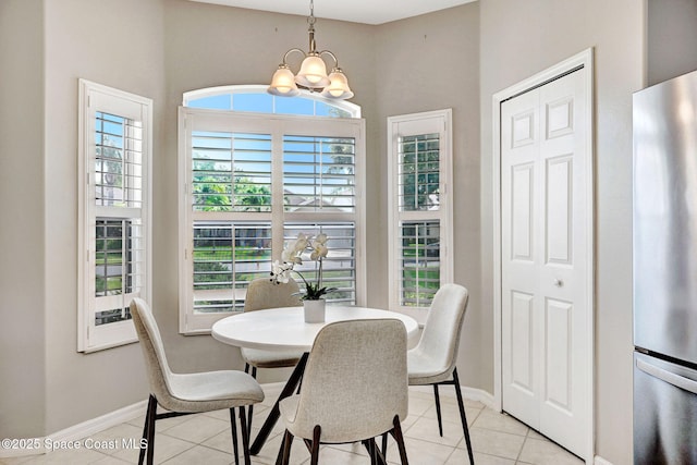 4490 Portage Trl, Melbourne, FL 32940 - dining room with a chandelier and light tile patterned floors