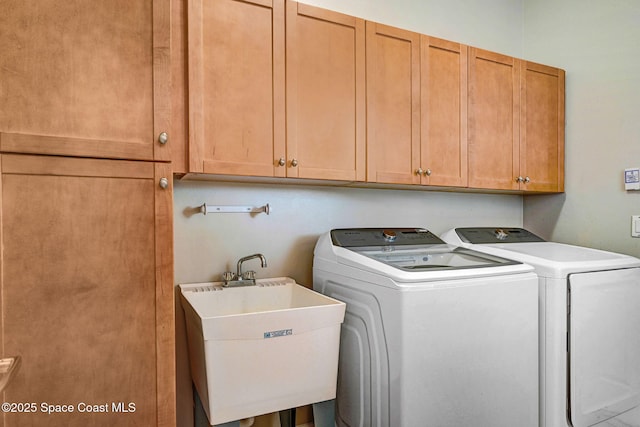 4490 Portage Trl, Melbourne, FL 32940 - washroom with cabinet space and washing machine and dryer
