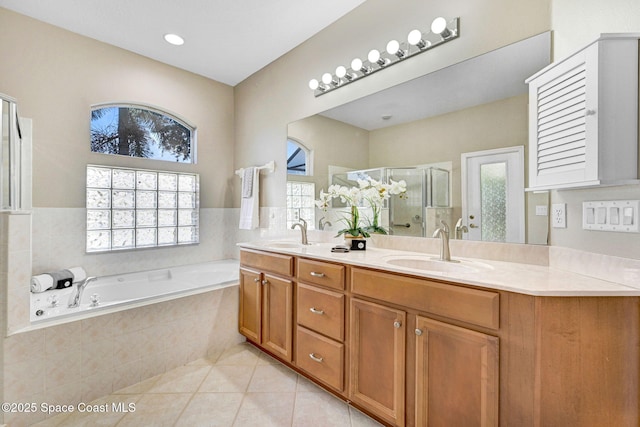 4490 Portage Trl, Melbourne, FL 32940 - bathroom with tile patterned flooring, double vanity, a stall shower, and plenty of natural light