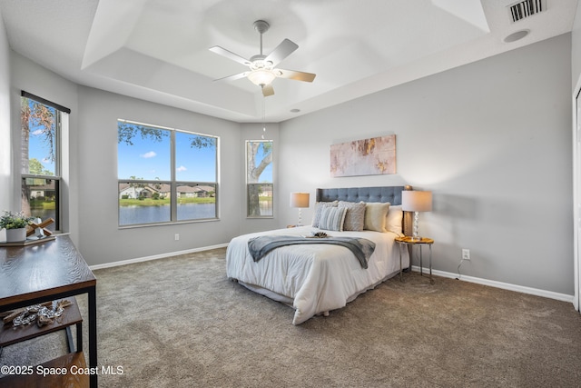 4490 Portage Trl, Melbourne, FL 32940 - bedroom with a raised ceiling, carpet, and ceiling fan