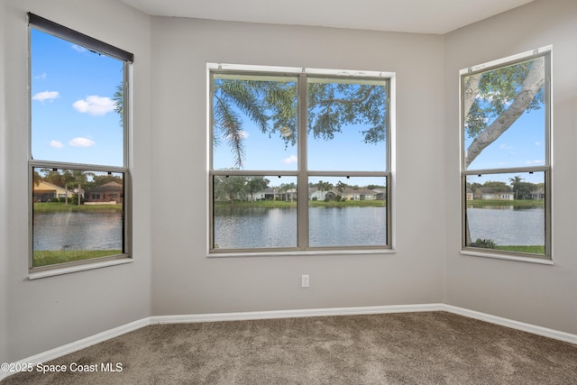 4490 Portage Trl, Melbourne, FL 32940 - empty room featuring carpet flooring and a water view