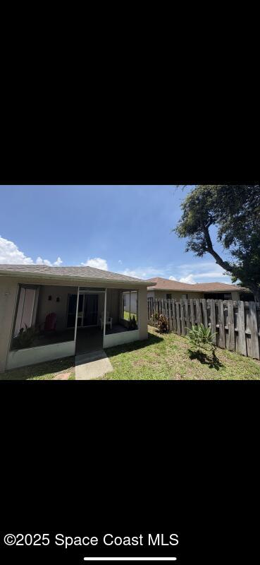 4094 Wilkes Dr, Melbourne, FL 32901 - back of house with a sunroom