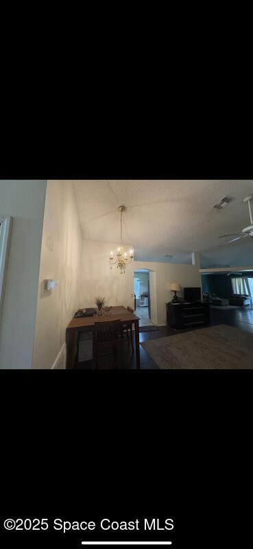 4094 Wilkes Dr, Melbourne, FL 32901 - stairs with a chandelier