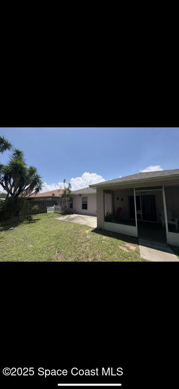 4094 Wilkes Dr, Melbourne, FL 32901 - back of house featuring a sunroom