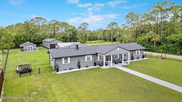 3440 Pine St, Cocoa, FL 32926 - rear view of house featuring a patio, a fenced backyard, stucco siding, and view of wooded area