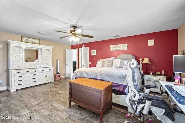 3440 Pine St, Cocoa, FL 32926 - bedroom with wood finished floors and a ceiling fan