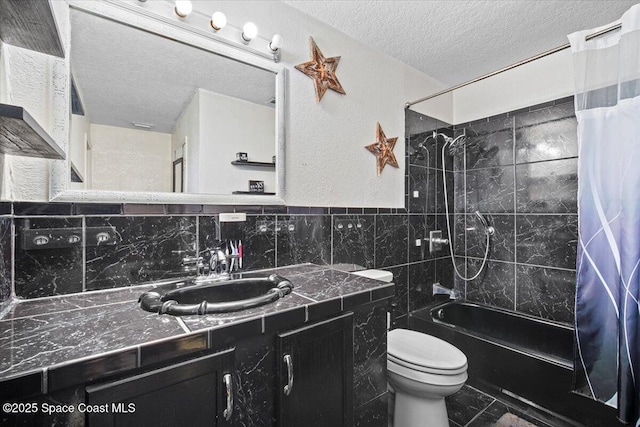 3440 Pine St, Cocoa, FL 32926 - full bath featuring a textured ceiling, shower / tub combo with curtain, vanity, and tile walls