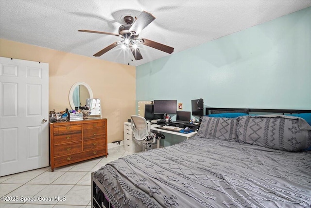 3440 Pine St, Cocoa, FL 32926 - tiled bedroom featuring a textured ceiling and ceiling fan