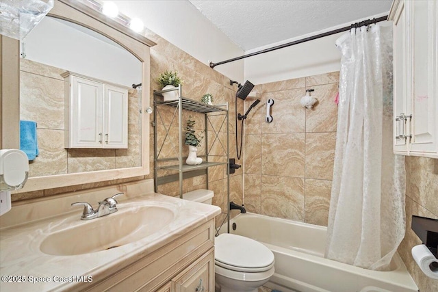 3440 Pine St, Cocoa, FL 32926 - full bathroom featuring shower / tub combo with curtain, vanity, a textured ceiling, and tile walls