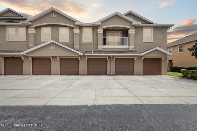4107 Meander Pl Unit 104, Rockledge, FL 32955 - multi unit property featuring stucco siding, driveway, a balcony, and an attached garage