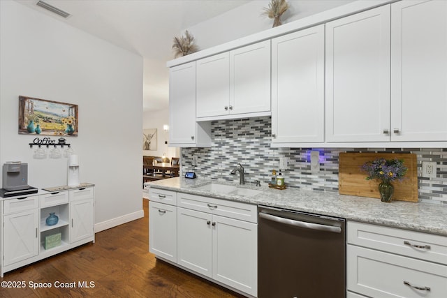 4107 Meander Pl Unit 104, Rockledge, FL 32955 - kitchen with dishwasher, tasteful backsplash, dark wood-style flooring, and light stone countertops
