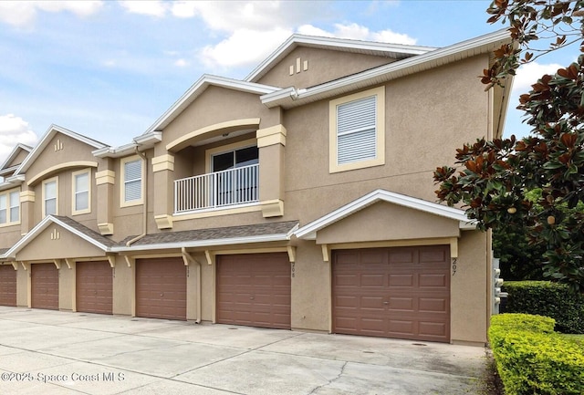 4107 Meander Pl Unit 104, Rockledge, FL 32955 - multi unit property featuring a balcony, stucco siding, concrete driveway, and an attached garage