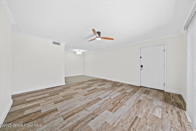 2190 Forest Knoll Dr NE Unit 90-104, Palm Bay, FL 32905 - spare room featuring ornamental molding, ceiling fan, and wood finished floors