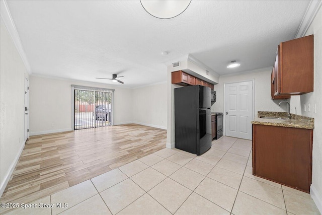 2190 Forest Knoll Dr NE Unit 90-104, Palm Bay, FL 32905 - kitchen with freestanding refrigerator, a ceiling fan, ornamental molding, open floor plan, and stove
