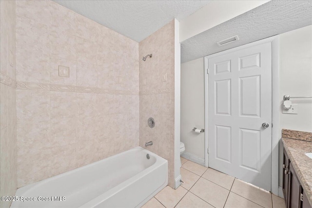 2190 Forest Knoll Dr NE Unit 90-104, Palm Bay, FL 32905 - bathroom featuring tile patterned floors, a textured ceiling, vanity, and shower / washtub combination