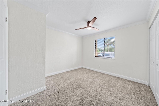 2190 Forest Knoll Dr NE Unit 90-104, Palm Bay, FL 32905 - unfurnished bedroom featuring crown molding, carpet flooring, a closet, a textured ceiling, and ceiling fan